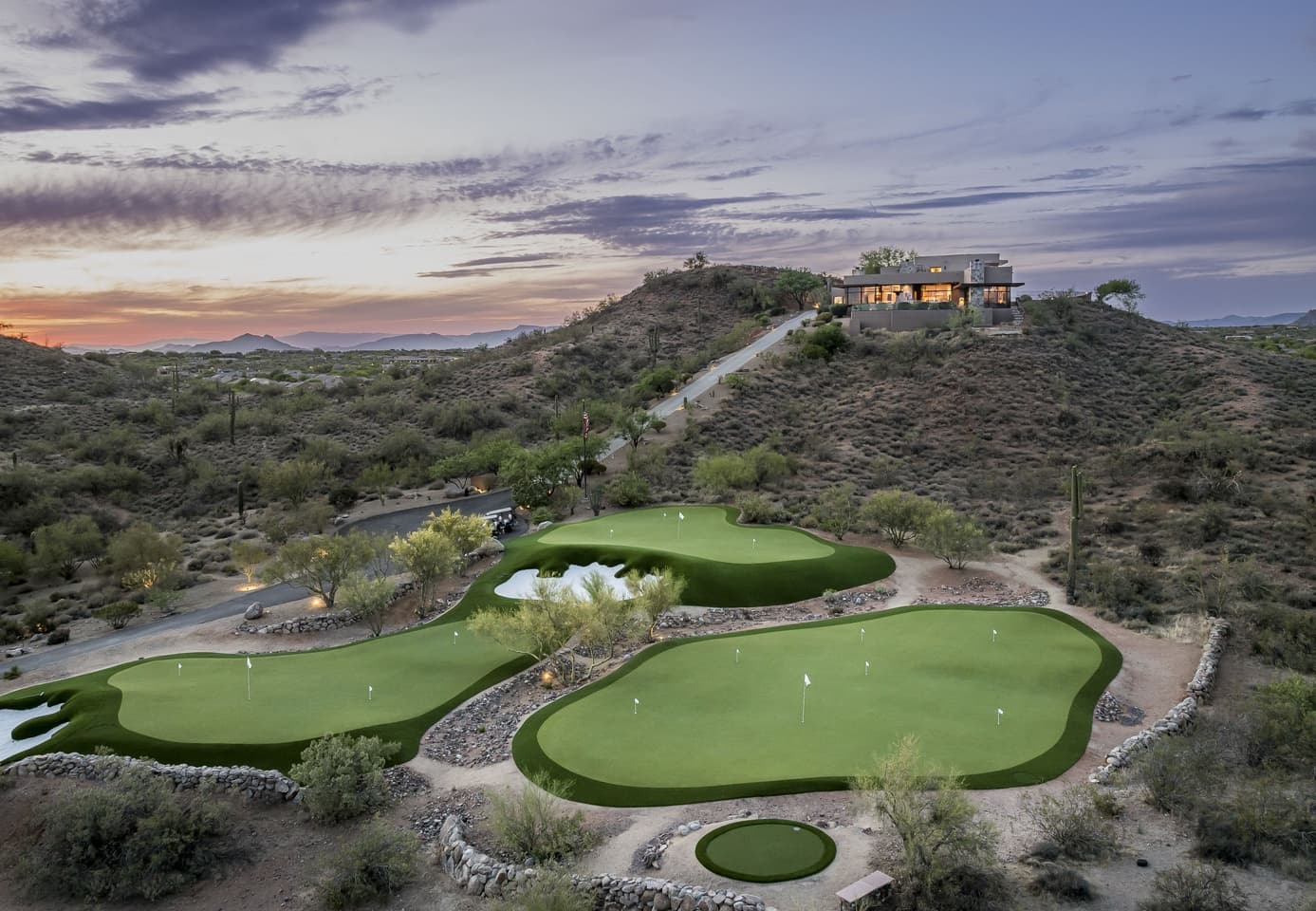 Aerial view of the Saguaro Point estate and full private golf complex at sunset