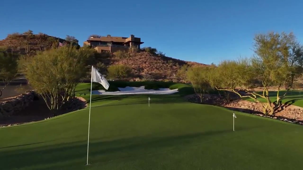 Aerial view of the three private putting greens at Saguaro Point, a luxury golf estate in North Scottsdale, Arizona